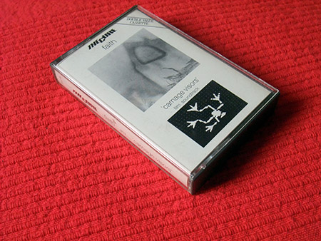 The Cure 'Faith'/'Carnage Visors' UK cassette (front)