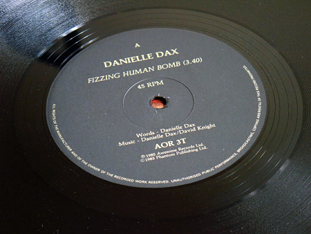 Danielle Dax 'Fizzing Human Bomb'/'Yummer Yummer Man'/'Bad Miss M' double A side 12 inch single - label design side A