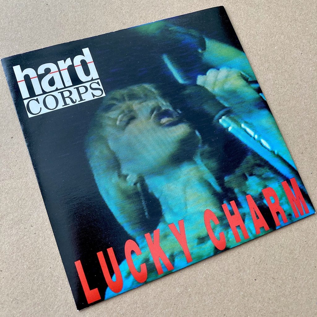 Hard Corps - Lucky Charm UK 7 inch single front cover