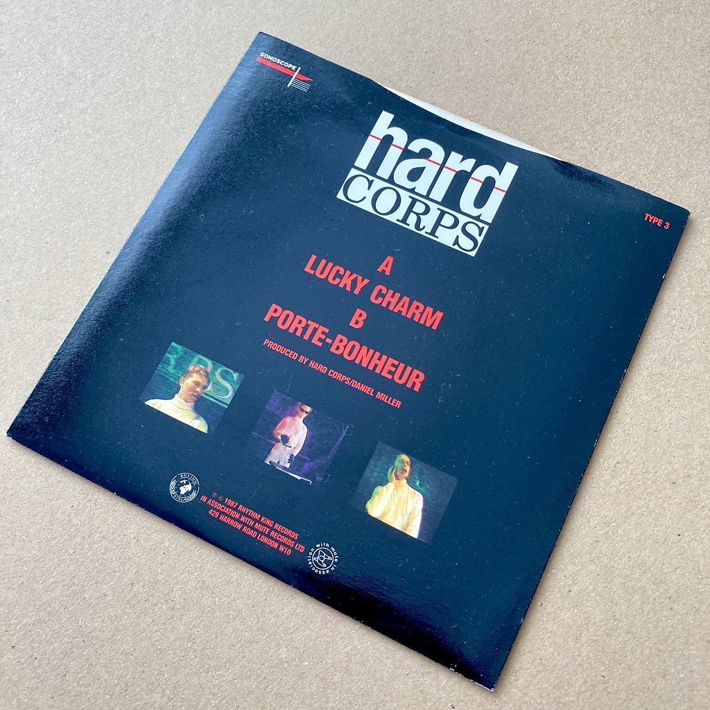 Hard Corps - Lucky Charm UK 7 inch single rear cover