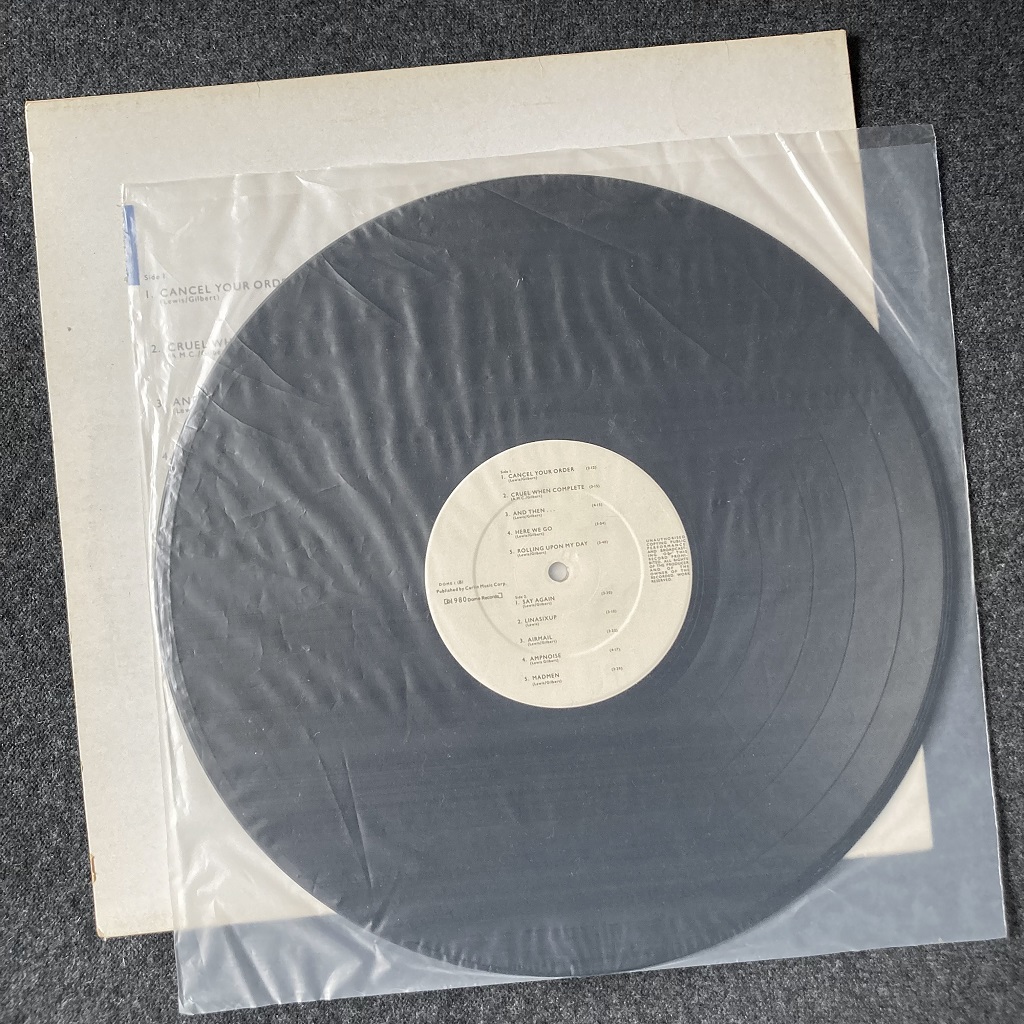 Dome 'Dome 1' 1980 UK LP label side B and inner bag
