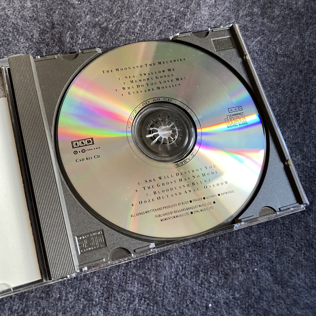 Harold Budd, Elizabeth Fraser, Robin Guthrie, Simon Raymonde: 'The Moon And The Melodies' CD label design