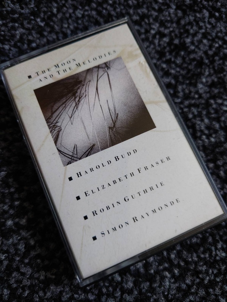 Harold Budd, Elizabeth Fraser, Robin Guthrie, Simon Raymonde: 'The Moon And The Melodies' - cassette front case