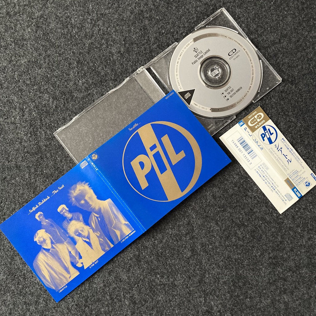 Public Image Ltd. - 'Seattle' Japanese CD single insert (front) disc and OBI.